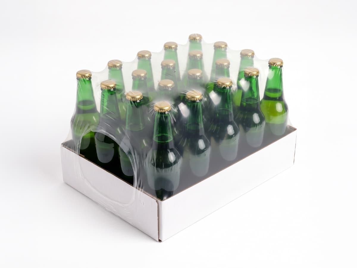 Cardboard tray with beer bottles, shrink-wrapped